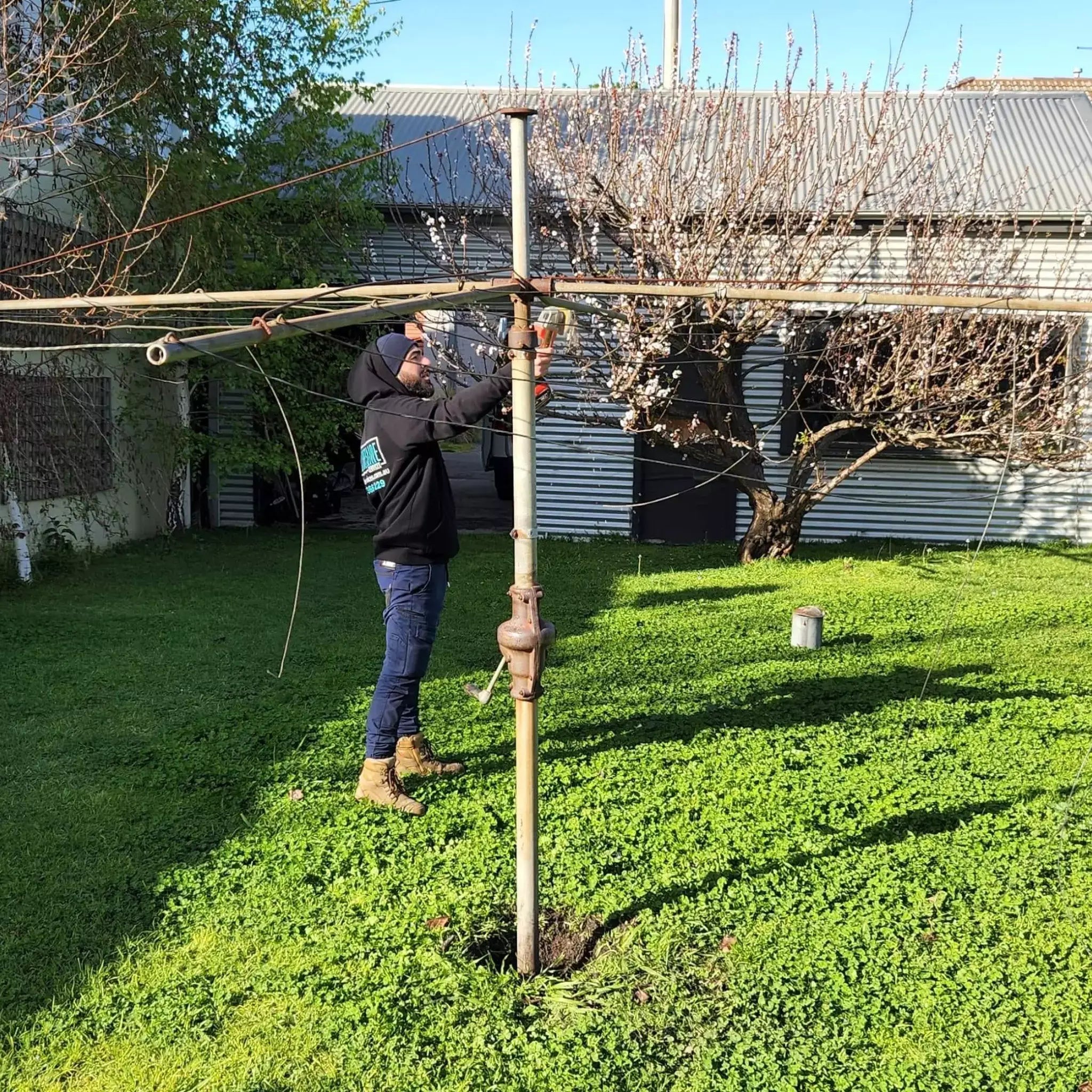 Restring old rotary clothesline with new wire in Melbourne.